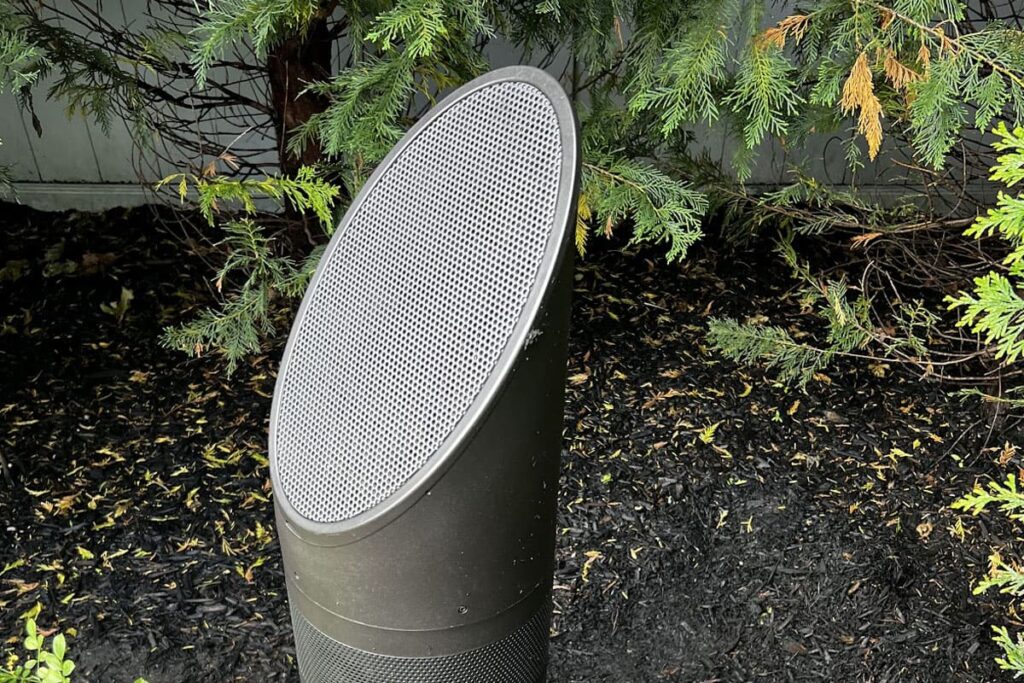 High-performance outdoor speaker systems installed in a landscaped garden for clear, balanced sound coverage.